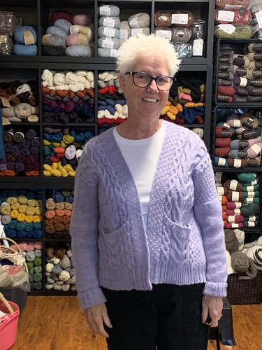 Debbie is wearing her Winters Beach Cardi by Andrea Mowry knit using Kelbourne Woolens Andorra.