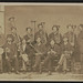 [Twelve unidentified soldiers in a Union regimental band with cornets, saxhorns, French horn, and drums in partial uniforms] (LOC)