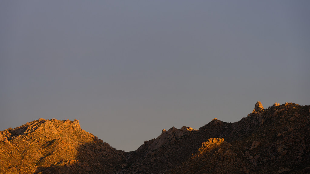 The last light of sunset falls on Tom's Thumb and the McDowell Mountainss in Scottsdale, Arizona on August 2, 2022. Original: _Z723751.NEF