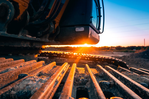 Heavy Equipment Sunset by 75CentralPhotography, The sun sets on a piece of construction equipment at a construction site near Celina, Texas.celina c
