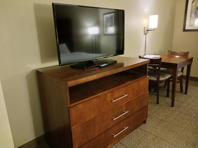 Television, Chest Of Drawers, Tables, And Chairs.