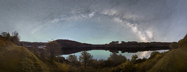 Panorama of the Milky Way arch over Clatworthy Reservoir on Exmoor
