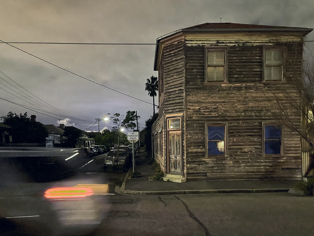A a car whizzes past, on a cold wintery night in Seddon, Melbourne, Australia.