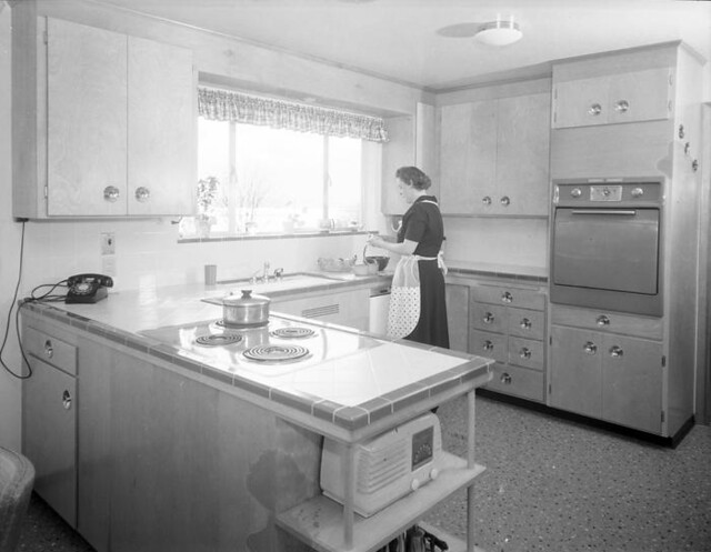 Woman in kitchen, 1956