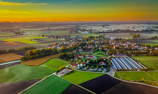 Aerial view of Bavarian landscape during morning sunrise with layer of fog on decent to Munich International Airport (MUC) Munich Germany