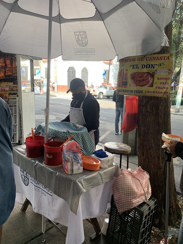 On every corner of every street. This seller has been selling tacos de canasta (basket tacos) from this corner for 30 years
