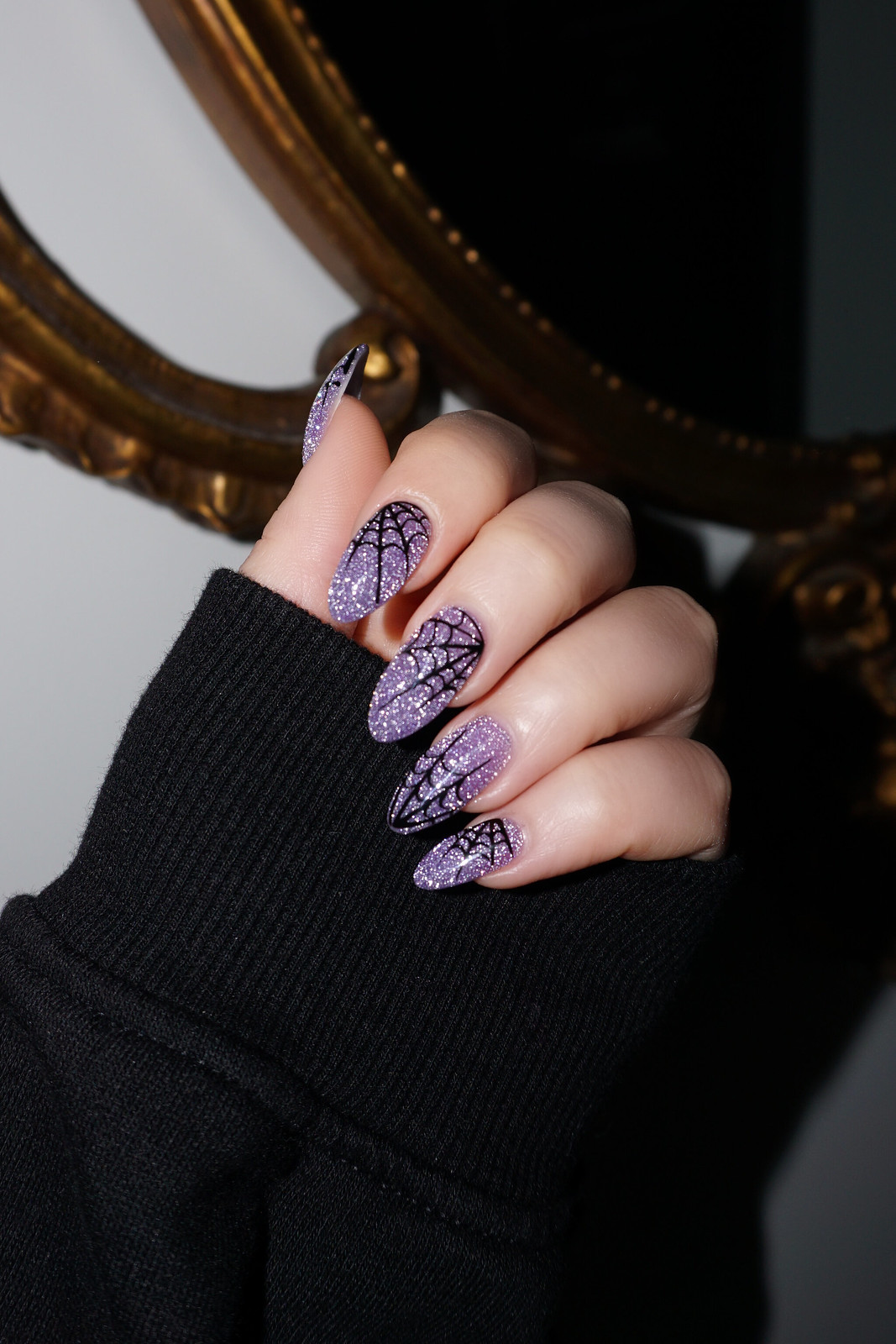Living After Midnite Blogger Jackie Giardina sharesBest Halloween Nails - in photo: Purple Glitter Spiderweb Nails 