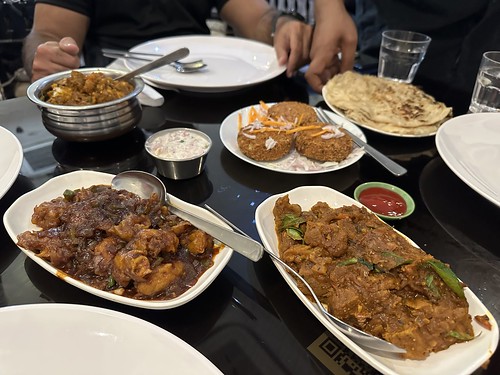 Clockwise from upper left: kappa briyani, fish cutlets, gobi manchurian, and mutton roast