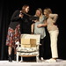 Geenie, Kat, and Vicki look through a family photo album together by actacommunitytheatre
