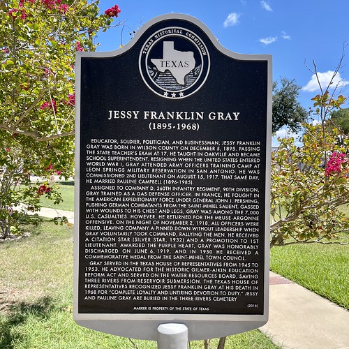 Jessy Franklin Gray (1895-1968)

Educator, soldier, politician, and businessman, Jessy Franklin Gray was born in Wilson County on December 5, 1895. Passing the state teacher’s exam at 17, he taught in Oakville and became school superintendent. Resigning when the United States entered World War I, Gray attended army officers training camp at Leon Springs Military Reservation in San Antonio. He was commissioned 2nd Lieutenant on August 15, 1917. That same day, he married Pauline Campbell (1896-1985).

Assigned to Company D, 360th Infantry Regiment, 90th Division, Gray trained as a Gas Defense Officer. In France, he fought in the American Expeditionary Force under General John J. Pershing, pushing German combatants from the Saint-Mihiel salient. Gassed with wounds to his chest and legs, Gray was among the 7,000 U.S. casualties. However, he returned for the Meuse-Argonne offensive. On the night of November 2, 1918, all officers were killed, leaving Company A pinned down without leadership when Gray voluntarily took command, rallying the men. He received a Citation Star (Silver Star, 1932) and a promotion to 1st Lieutenant. Awarded the Purple Heart, Gray was honorably discharged on June 6, 1919, and in 1950 he received a commemorative medal from the Saint-Mihiel town council.

Gray served in the Texas House of Representatives from 1945 to 1953. He advocated for the historic Gilmer Aikin Education Reform Act and served on the Water Resources Board, saving Three Rivers from reservoir submersion. The Texas House of Representatives recognized Jessy Franklin Gray at his death in 1968 for “complete loyalty and untiring devotion to duty.” Jessy and Pauline Gray are buried in the Three Rivers Cemetery.

(2018)

Marker is Property of the State of Texas