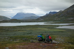 Taking a break on the second to last day.  The Kings Trail delivers views over Áhpparjávri and the surrounding mountains.