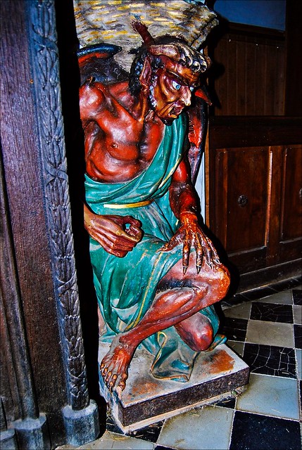The demon Asmodeus supporting the holy water font in the Church of Saint Mary Magdalene in Rennes-le-Château, France