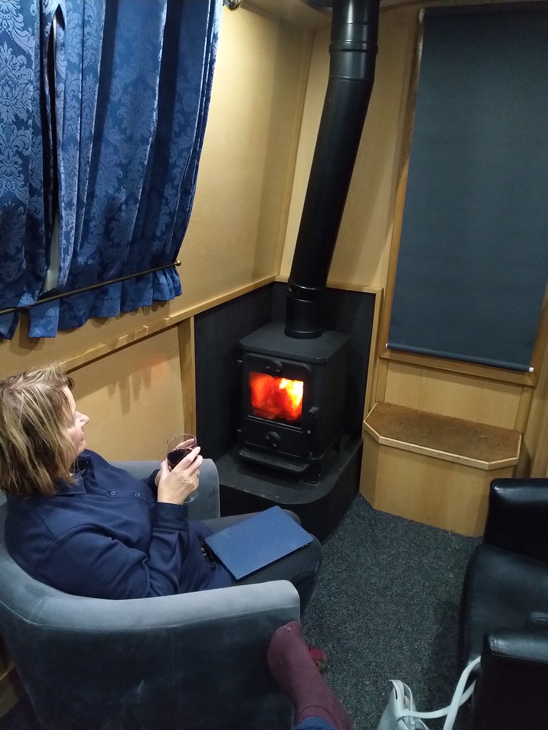 Sitting cosily around our wood-burning stove on the Cunningham narrowboat