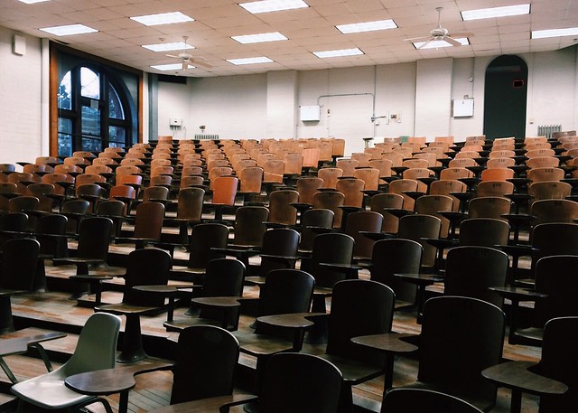 Empty auditorium with lights dimmed - For-Profit Colleges: What to Know & Why to Avoid Them