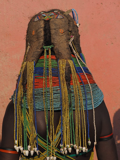 Mwila sporting four thick Nontombi dreadlocks with beaded adornment on top of her head