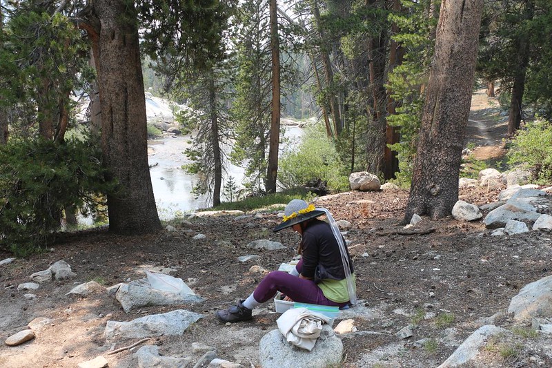 Vicki is doing our overdue laundry near the shore of Bear Creek, just off the John Muir Trail