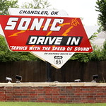 Sonic Drive In on Route 66 Service with the speed of Sound

The Sonic Drive In along Route 66 in Chandler, OK has an interesting sign.  I&#039;m not sure if it&#039;s a new sign to look old or a repurposed old sign, but the neon tubing has been removed.  I&#039;m guess it&#039;s new as this location has been here less than three years - they moved across the street and this was a residential lot.