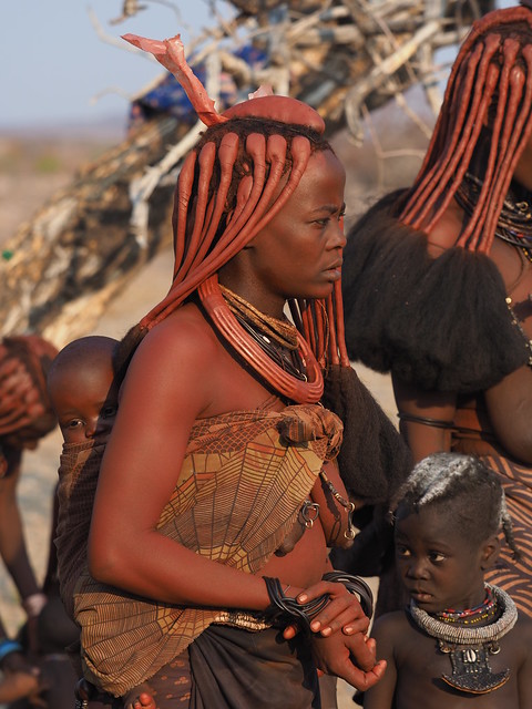 The Otjize paste gives the Himba's skin and hair a glowing copper tone