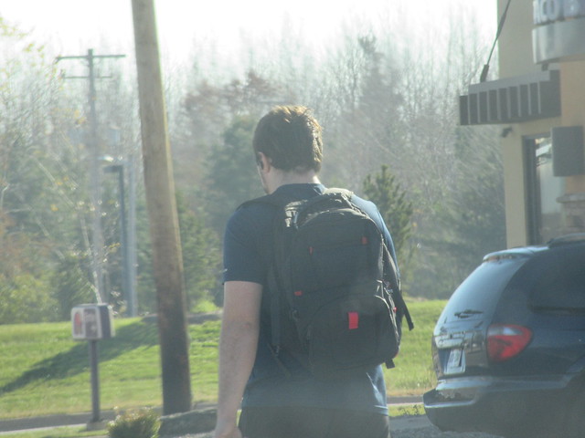 Back of Man Walking with Backpack