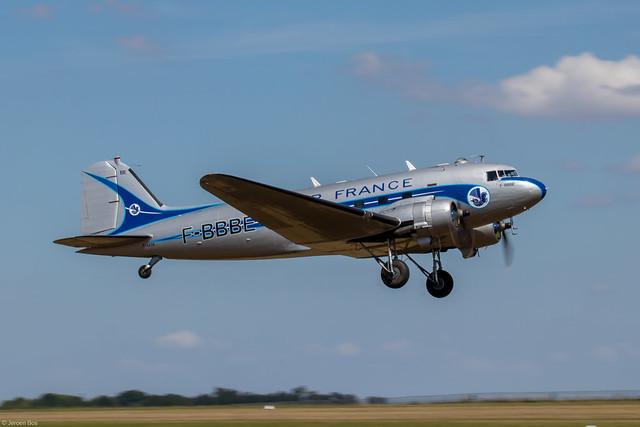 Douglas C-47, currently as Air France DC-3 F-BBBE, taking off from a grass runway at the Meaux Airshow 2022, France