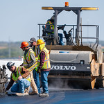 LSB Construction - September 29th, 2022 Nebraska DOT inspectors work with our contractor partners to insure a high quality asphalt overlay. In the background a vibratory roller compacts the newly laid asphalt.