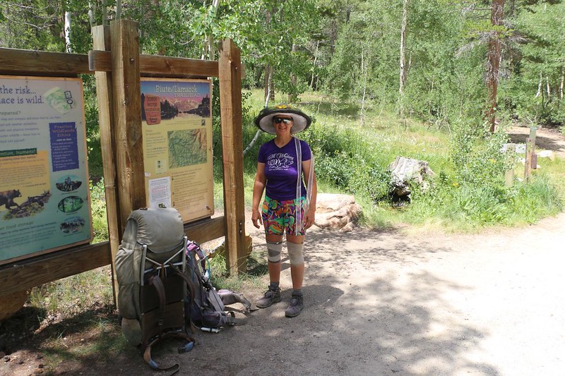 Vicki at the Piute Pass Trail trailhead sign - she stayed with the backpacks while I hiked onward to the hiker parking lot