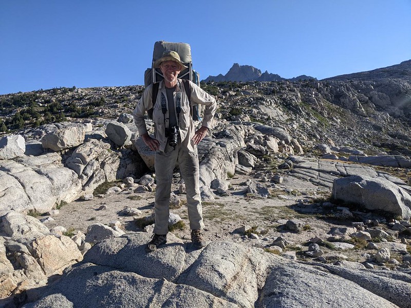 Me, on Piute Pass, with the summit of Mount Humphreys visible over the ridge behind me