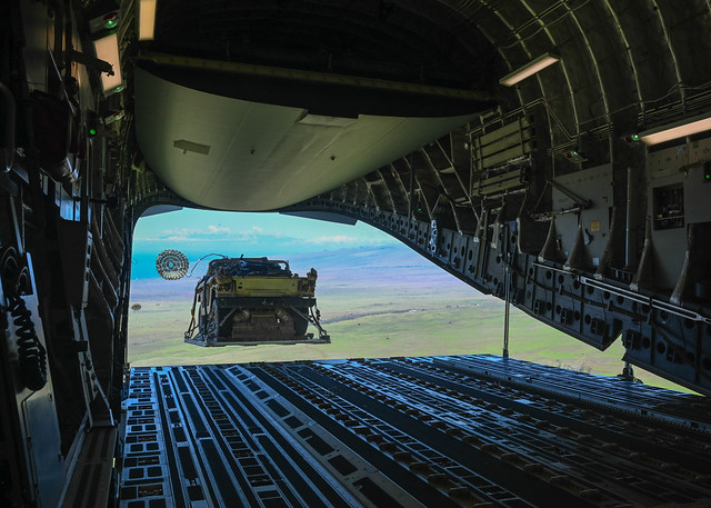 An U.S. Army HMMWV is airdropped from a USAF C-17 Globemaster III during JPMRC 23-01