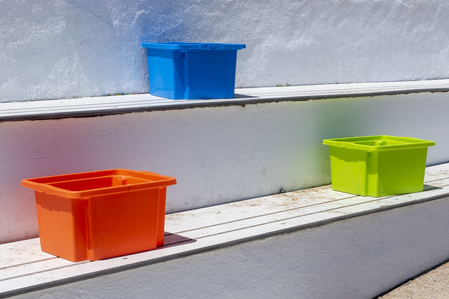 Three colored plastic container