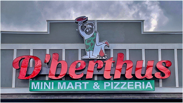 Sign with logo / D’berthus Mini Mart & Pizzeria / Powers Ferry Road / Marietta, Georgia