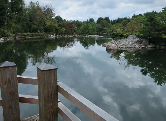 Railing of the zig-zag bridge on the garden pond