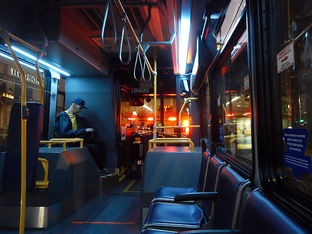 On the night bus home through Vancouver city lights