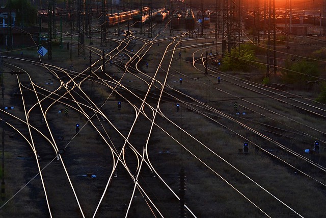 Intersection Point Of Multiple Railroad Tracks at Sunset