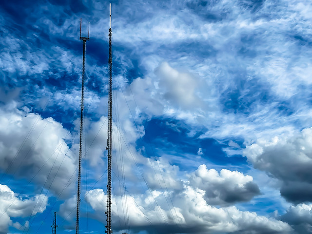 Radio towers with a backdrop of a  beautiful drama of the clouds