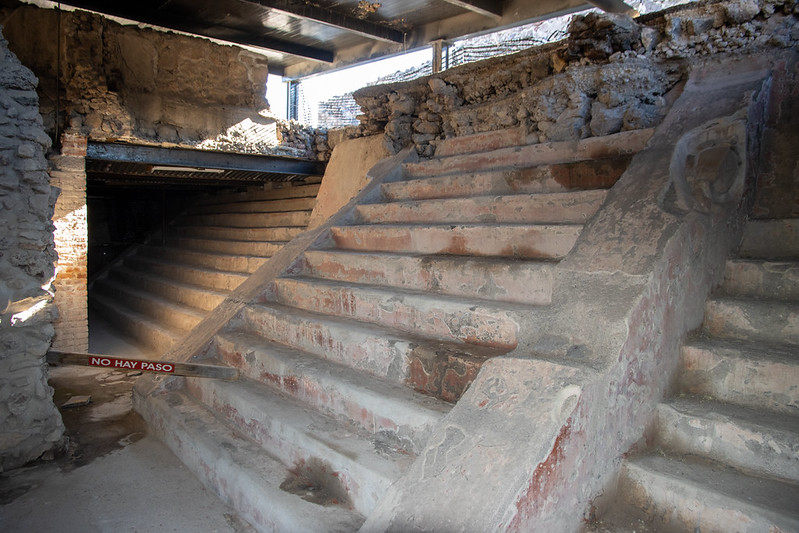 Underneath one of the old pyramids to see the old one.