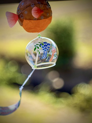 Japanese blowfish “fuurin” wind chime blowing in the wind—Japanese countryside. Pancolar.
