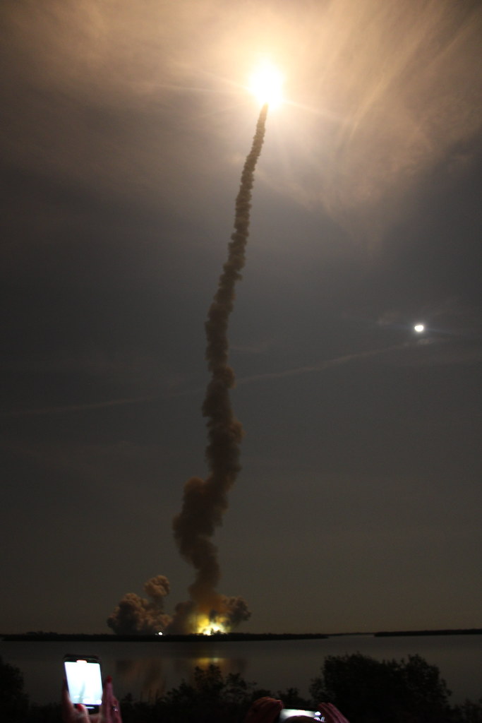  SLS high up in the sky with long smoke trail. (copyright: International Space Education Institute)