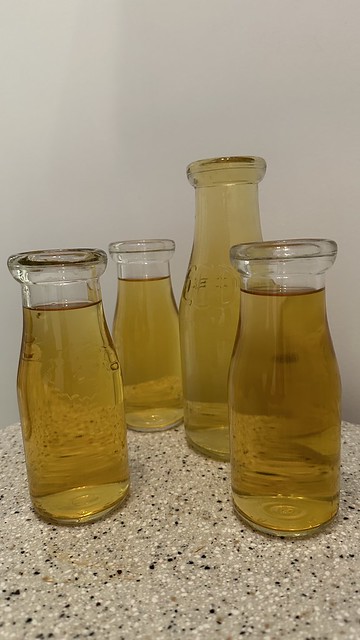 Milk bottles filled with apple juice