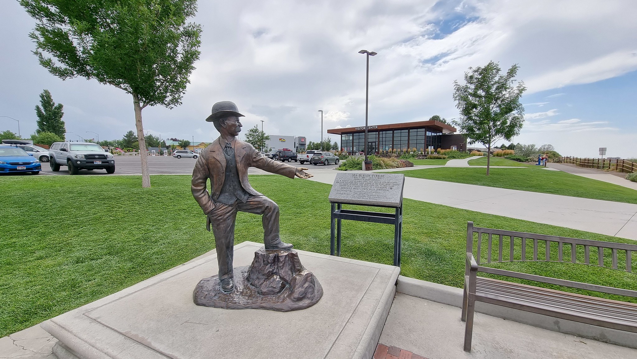 A view of the statue of Ira Burton Perrine with the Visitors Center in the background at Twin Falls