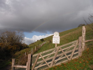 National Trust Sign at bottom of fenced area around The Cerne Giant, with rainbow SWC Walk 402 - Maiden Newton Circular or to Dorchester (via Cerne Abbas) [Giant Hill Extension]