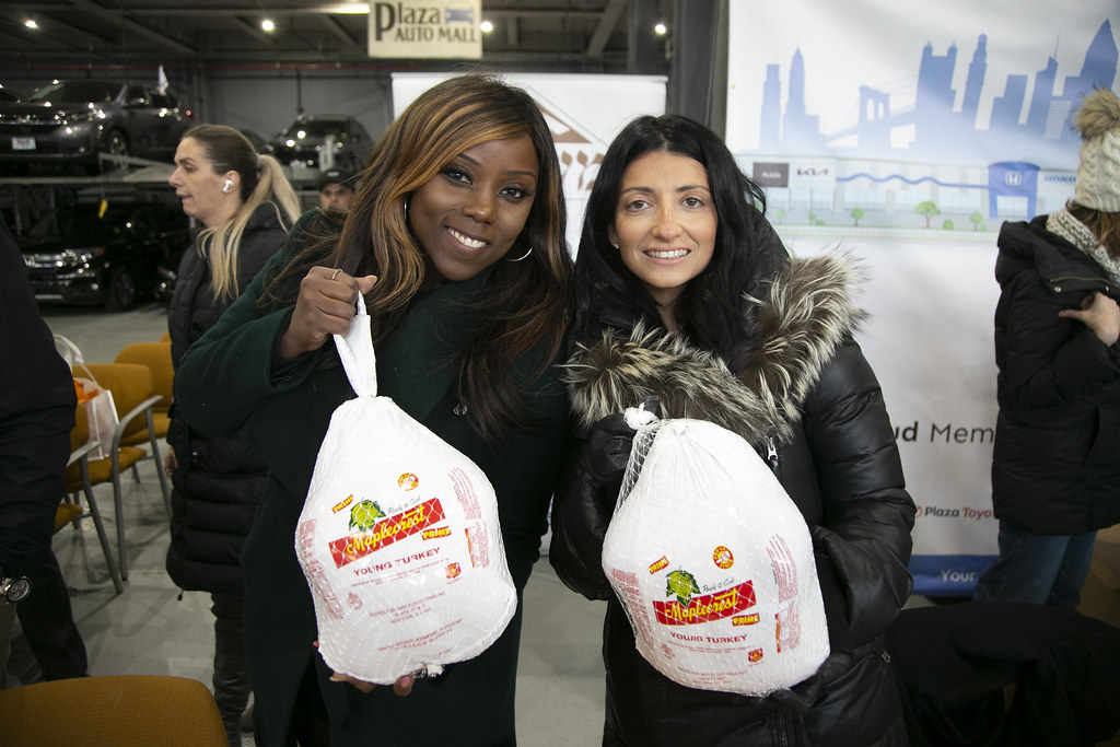 Council Members Farah Louis and Inna Vernikov Giveaway Turkeys at Plaza Auto Mall