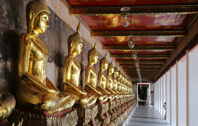 About 150 Buddha statues around the inner corridor of Wat Suthat Thepwararam