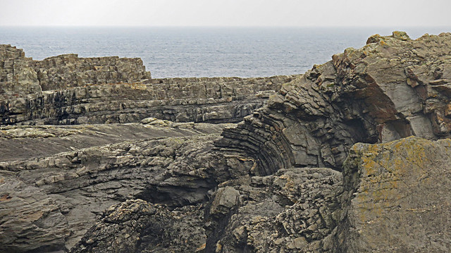 the striations in the cliffs turn sideways near Loop Head Lighthouse in Ireland