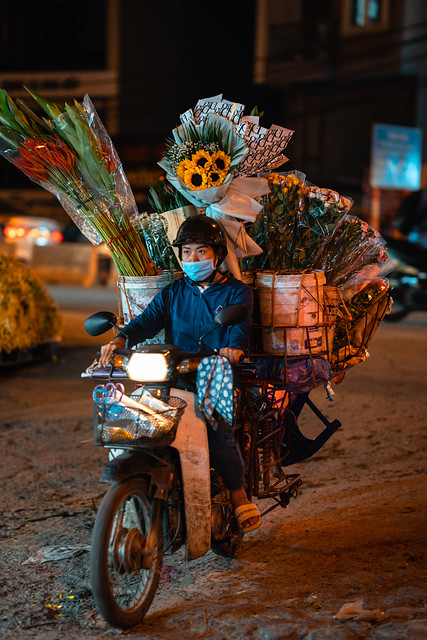 Woman Deivering Flowers to Market on Motorcycle, Hanoi Vietnam