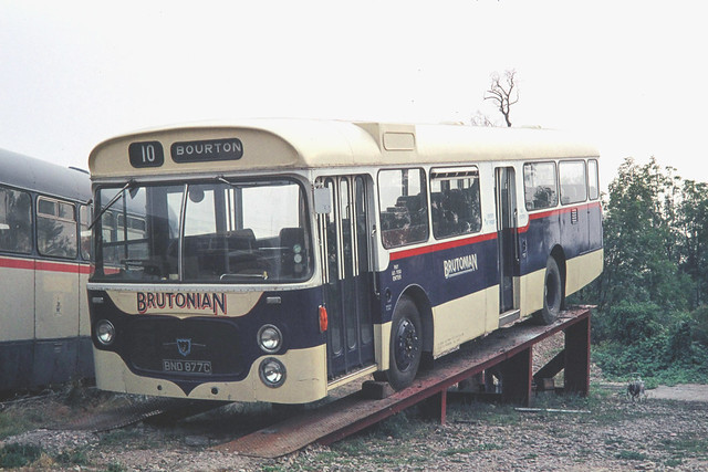 Brutonian ( C P Knubley ) . Bruton , Somerset . BND877C. Station yard , Bruton , Somerset . Saturday afternoon . 07th-August-1976.