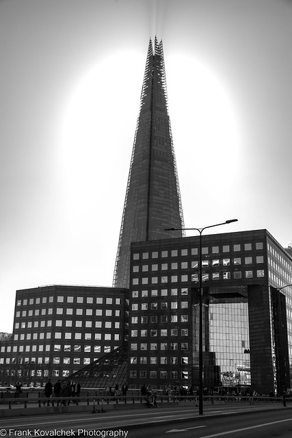 The Shard in the fog with the sun burning through