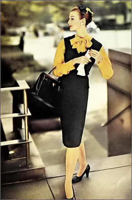Mary Jane Russell in hand-loomed black knit sleeveless sweater with a brilliant golden-yellow shantung shirt by Traina-Norell, photo by Wilhela Cushman, Ladies' Home Journal, October 1959