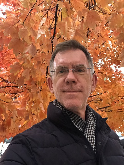 Paul with orange leaves, fall color at Parker Lee Park, Q and 20th streets NW, Washington, D.C.