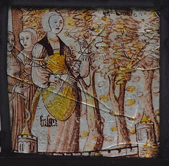 a noble woman holding a flower and watching from the battlements (16th Century?)