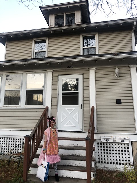 Zoe dressed up as Cindy Lauper for Halloween and standing infront of our old place on Clemons